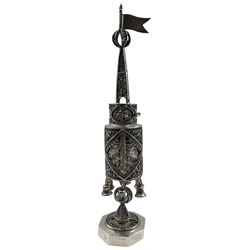Edwardian silver filigree spice tower (Besamim), the body formed as two cylindrical tiered containers, one with a small hinged door and the other suspending six silver bells, the steeple cover with ball finial and pennant, supported by an octagonal pedestal foot, by Atkin Brothers, London 1904 H29cm