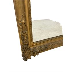 Victorian gilt framed wall mirror, the corners applied with moulded acanthus leaves and rose garlands, with an ornate slip