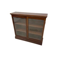 Edwardian mahogany bookcase, rectangular top over two glazed doors enclosing two adjustable shelves 