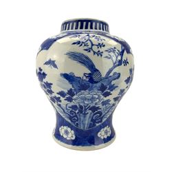 Late 19th century Chinese baluster form jar, painted in underglaze blue with two barbed lobed panels of exotic birds, insects, fruit and foliage, on a prunus and crackled ice ground, Kangxi character marks to base, lacking cover, H24cm