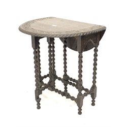 18th century style oak drop leaf table, circular top carved with floral decoration, raised on bobbin turned supports with gate leg action, D61c