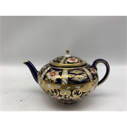 Vienna style cabinet cup and saucer decorated with panels of classical scenes with floral gilt detailing together with Royal Crown Derby Imari cabinet cup and saucer and miniature teapot (3)