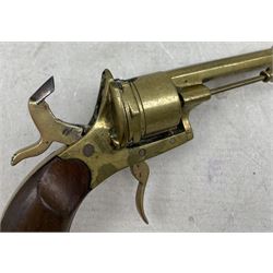 Novelty brass cigar cutter in the form of a revolver pistol with walnut grip, L17cm