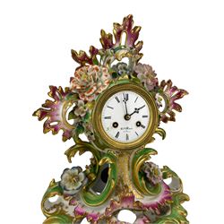 Henry Marc of Paris - early 19th century 8-day French mantle clock c1820, in a porcelain rocaille scroll design case encrusted with flowers and gilt leaf ornament, enamel dial with makers name, Roman numerals, trefoil steel hands within a gilt bezel, countwheel striking movement and silk suspension, striking the hours and half hours on a bell.