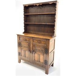 18th century style medium oak dresser, with two height plate rack over two drawers and two lunette carved panelled cupboards enclosing shelf, raised on block supports, W103cm, H172cm, D44cm