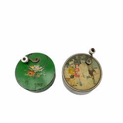 Child's 19th century small circular music box printed with children and snowman and another, each D7cm
