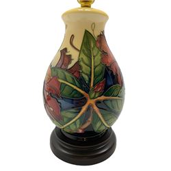 Moorcroft table lamp decorated in the 'Simeon' pattern by Philip Gibson, of baluster form on turned ebonised base, with shade, H45cm including shade 
