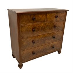 Victorian mahogany straight-front chest, fitted with two short and three long drawers, each with cockbeaded fronts and turned mahogany handles, flanked by reeded uprights, raised on lobe carved turned feet 