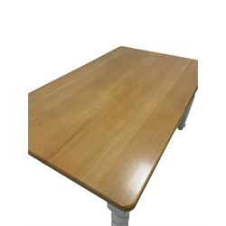 Contemporary dining table, the beech top over painted base, raised on turned supports 