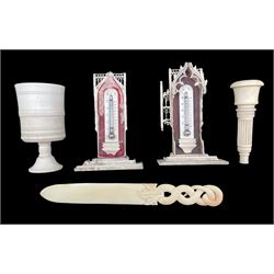 Pair of late 19th century Ivory thermometers, paper knife engraved with a crest, ivory chalice and an ivory stand 