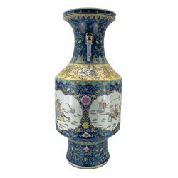 20th century Chinese twin handled floor vase, the cylindrical form body painted with alternating panels of figures and children playing, against a foliate and blue enamel ground, with yellow-banded shoulder and partly gilded mask handles, H92cm 