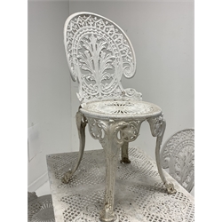 Victorian style white painted aluminium garden table, rectangular pierced top over shaped apron, raised on cast floral supports and stretcher, (94cm x 63cm, H70cm) together with a similar set of four garden chairs, (W40cm)