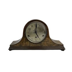 A 1930’s oak cased three train Westminster chime mantle clock in an tambour case, with a silvered dial, Arabic numerals and minute track, steel spade hands within a brass bezel and convex glass, with pendulum.



