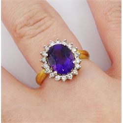 18ct gold oval amethyst and round brilliant cut diamond cluster ring, hallmarked