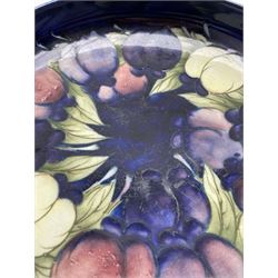 Moorcroft circular bowl decorated with the wisteria and plum pattern, signature to base D23cm