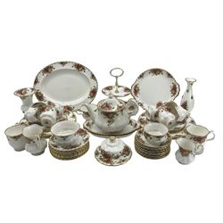 Royal Albert Old Country Roses tea and dinner service comprising six dinner plates, six dessert plates, pair of oval serving dishes, cake stand, nine cups and saucers, two mugs, nine tea plates, tea pot, two sugar bowls, two milk jugs, butter dish and cover, two vases and two cake plates (45)