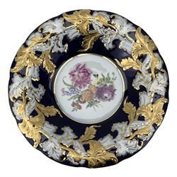 Meissen porcelain bowl (1924-1934) having central painted floral decoration within a relief gilt heightened acanthus border on cobalt blue ground, blue crossed sword mark and impressed C113B beneath, D25cm 