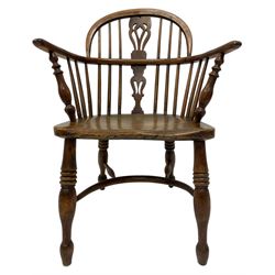 19th century elm and yew Windsor chair, low hoop stick back with pierced splat, dished seat raised on ring turned supports joined by crinoline stretcher