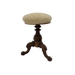 Victorian walnut piano stool, the upholstered seat over carved column leading into carved and splayed supports 