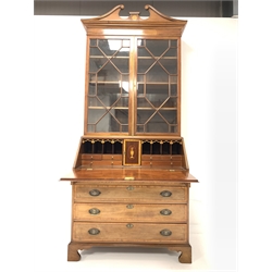 George III mahogany bureau bookcase, swan neck pediment with paterea inlay over astragal glazed doors enclosing three adjustable shelves, the cross banded and string inlaid fall front revealing well fitted interior, four drawers under, raised on shaped bracket supports, W99cm, H236cm, D50cm