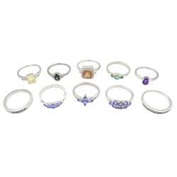 Ten silver stone set rings, including tanzanite, topaz, amethyst, hiddenite and andesine, all stamped or hallmarked 