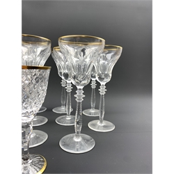 Part suite of Stuart Crystal Hardwicke pattern glasses with gilt rims, comprising ten large claret glasses and ten small claret glasses, together with a set of eight Spode crystal hock glasses with gilt rims (28)