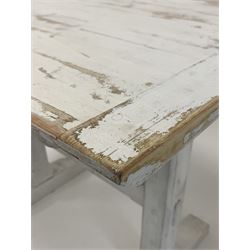 20th century Arts and Crafts style white painted pine table, rectangular top with chamfered edge raised on two square supports leading to sledge feet, united by chamfered stretcher 90cm x 65cm, H76cm