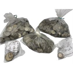 Approximately 3350 grams of pre 1947 Great British silver coins, including sixpences, shillings and florins / two shillings, a small number of pre 1920 silver sixpences and four Bank of England pound notes