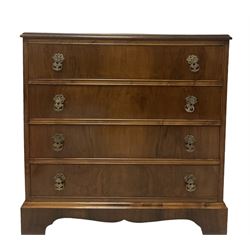 Mid-20th century walnut four drawer chest, raised on bracket supports 