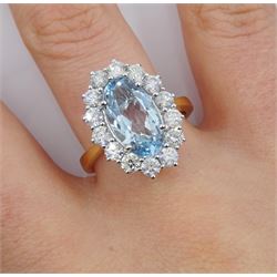 18ct gold oval aquamarine and diamond cluster ring, hallmarked, aquamarine approx 2.40 carat, total diamond weight approx 1.25 carat