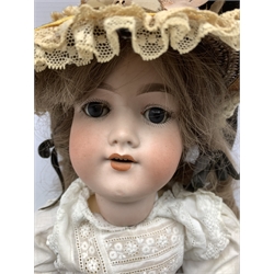Armand Marseille bisque head doll with sleeping eyes, open mouth and jointed limbs mould No. 390 H56cm, together with a childs nightdress, pinafore etc