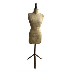 Early 20th century female torso dressmakers dummy or mannequin by R D Franks Ltd, Market Place, Oxford Circus, London W1, no. 38, of cloth construction with iron tripod base, H148cm x W37cm 