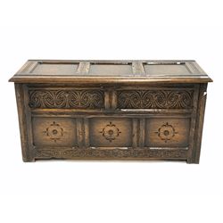 18th century style carved oak coffer, three panelled top lifting to reveal plain interior, floral carved five panel front, raised on stile supports W107cm
