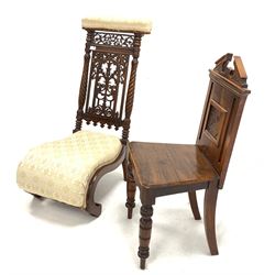 Victorian oak hall chair, broken arch pediment over floral carved panelled back, turned front supports (W43cm) together with a Victorian mahogany prie-dieu with profusely carved fretwork back panel and upholstered in ivory damask (W46cm)