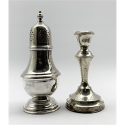 Silver vase shape sugar caster H18cm London 1961 6.3oz and a silver candlestick H14cm