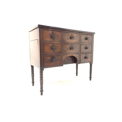 Regency mahogany kneehole sideboard fitted with seven drawers, raised on ring turned supports W110cm