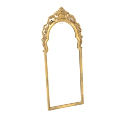 20th century gilt wall hanging mirror, the moulded arched frame surmounted by an urn issuing scrolled foliate