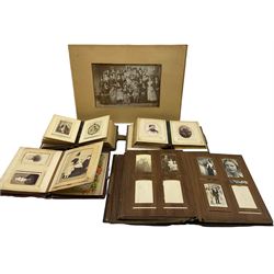 Victorian photograph album with wooden boards inscribed J W Rodgers, three smaller albums all with portrait photographs and a loose photograph (5)