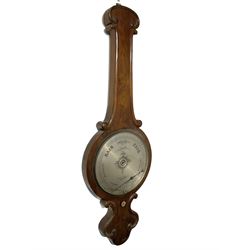 Robinson of Bradford -  late19th-century mercury wheel barometer in a mahogany case, with a scroll carved top and conforming base, 12-inch silvered register reading barometric air pressure in inches, steel indicating hand and brass recording hand with recording button. 
Daniel Robinson is recorded as working in Bradford as a barometer maker c.1870