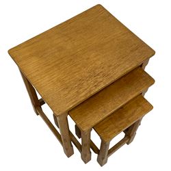 Mouseman - nest of three oak occasional tables, rectangular adzed tops on octagonal supports, each carved with mouse signature, by the workshop of Robert Thompson, Kilburn 