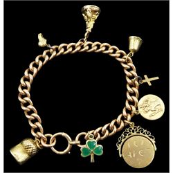 9ct rose gold curb link bracelet, with spring loaded barrel clasp and seven 9ct gold charms including green enamel shamrock, 'I Love You' spinner, fob and bell