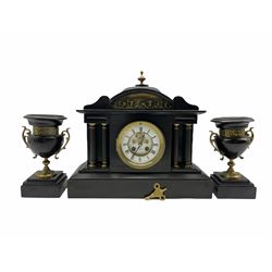 A late 19th century French eight-day twin train rack striking mantle clock striking the hours and half-hours on a coiled gong, white enamel recessed dial with Roman numerals and minute track, visible Brocot dead-beat escapement with semi-circular jewelled pallets, hinged cast brass bezel with bevelled glass, steel fleur de Lise hands and Brocot pendulum regulation arbor, dial inscribed “Benetfink & Co Ltd, London”, movement backplate stamped “A.D. Mougin  ‘Deux Medaille’s’” Serial No 61653, in a black Belgium slate case with a shaped pediment surmounted by an oblate dome and finial, curved recessed tympanum with a brass repousse frieze depicting a scene from Greek mythology, recessed reeded columns with brass capitals on a stepped plinth, matching Belgium slate garnitures, comprising wide rimmed urns with scroll handles supported by a cast circular foliate foot on a triple-stepped rectangular plinth. 
With pendulum & key.
 A D Mougin was a prolific French clockmaker working in the mid to late nineteenth century, manufacturing clock movements in the Montbeliard region of France, also listed as having premises on the Rue de Turenne in Paris, Mougin won two gold medals for his clocks at the Paris exhibitions of 1867 and 1879 which he used as the basis for his trademark which contain the ‘Deux Medaille’s’ . 
Benetfink & Co. were a large retail business located at 89-90 Cheapside, London, from c1845 to 1907
