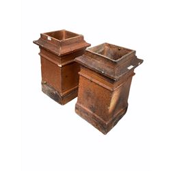 Pair of 19th century salt glazed chimney pots of square tapered form H59cm