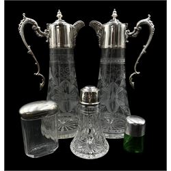 Edwardian green glass smelling salts jar by Sydney & Co, Birmingham 1903, silver mounted cut glass sugar caster by Walker & Hall, Sheffield 1936, a silver topped dressing table jar and a matched pair of silver-plated claret jugs by G.C.T & Co. Sheffield 