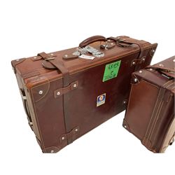 Graduating pair mid-20th century leather suitcases, with cream stitching (2)
