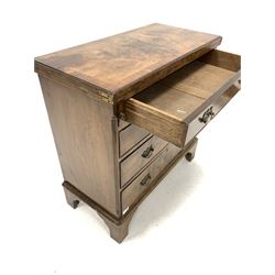 Early 20th century figured walnut bachelors chest, fold over top over four long graduated drawers, raised on shaped bracket supports W77cm