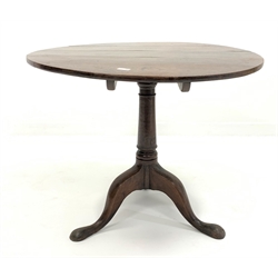 Georgian oak circular tilt top occasional table, raised on ring turned column and triple splay supports with pad feet, D84cm, H70cm