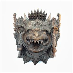 Eastern carved hardwood mask modelled as a mythical creature, H24cm 