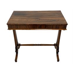 Early Victorian rosewood stretcher table, rectangular top on two tapered and pierced pillars, the skirt with scrolled brackets and turned roundels, splayed supports with turned feet joined by turned stretcher