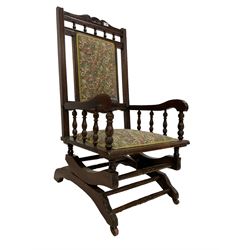 19th century American stained beech rocking chair, upholstered in floral pattern fabric